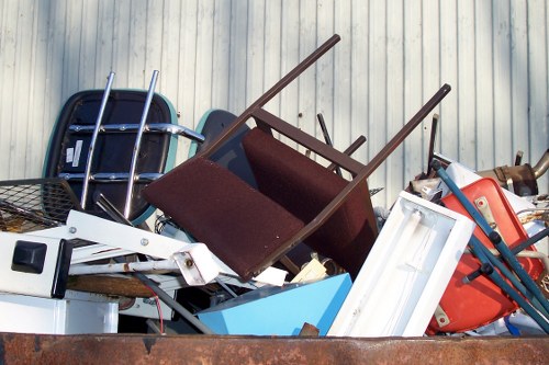 Professionals clearing furniture in a Newham home